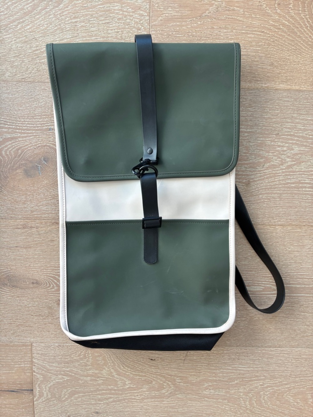 Rains waterproof Olive Green and Cream Roll-Top Backpack with Black Straps